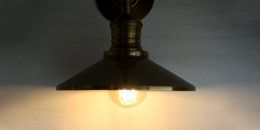 Antique brass wall light with halogen style filament light bulb